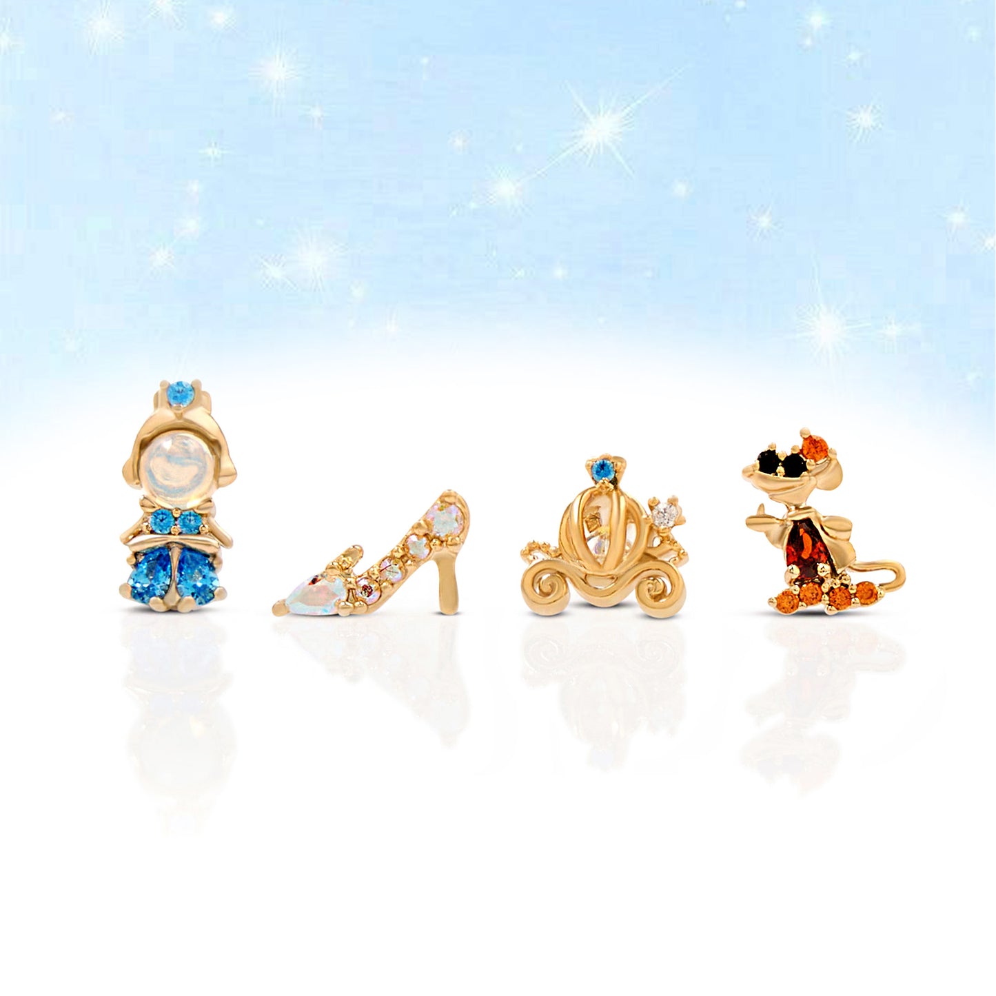 Set of gold Cinderella earring set on a sparkling background