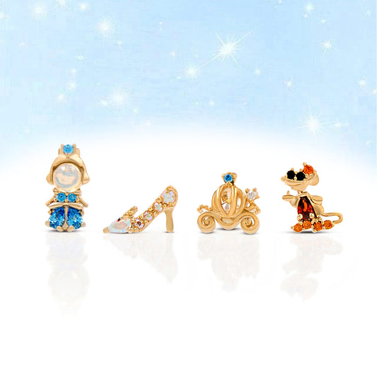 Set of gold Cinderella earring set on a sparkling background