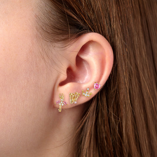 Close-up of an ear wearing gold Dancing Princess Earring Set