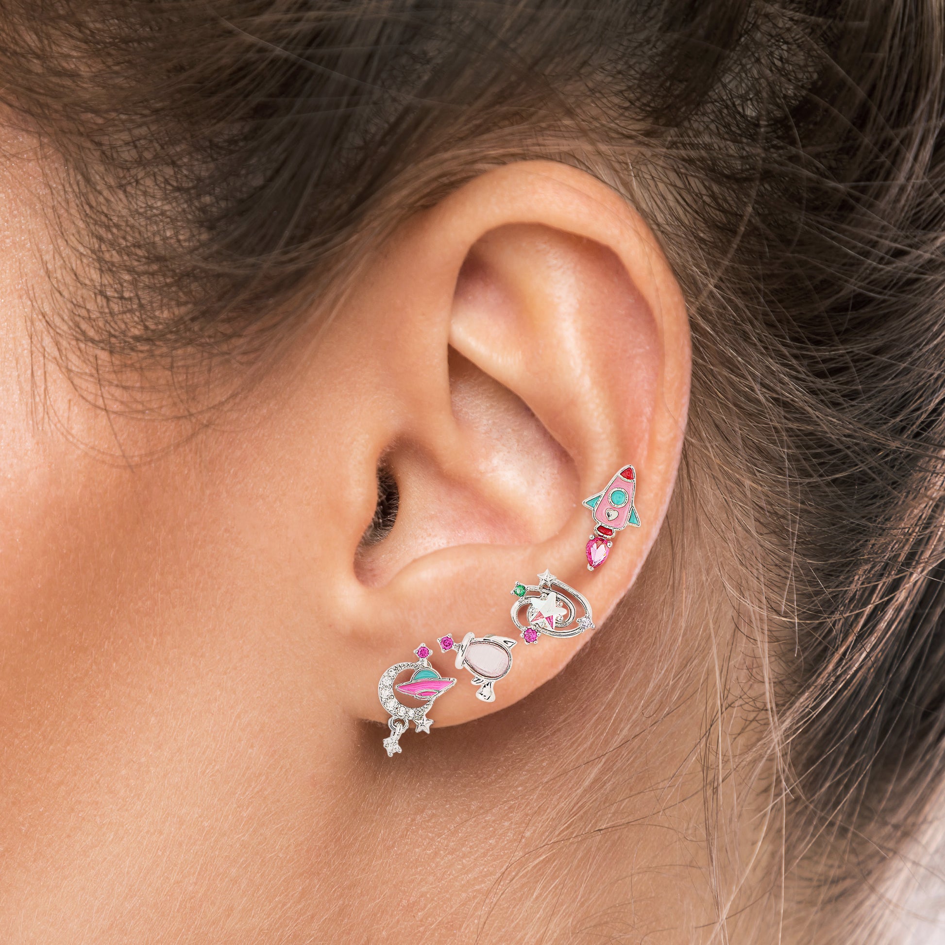 Close-up of an ear with Galaxy Adventures earring set 