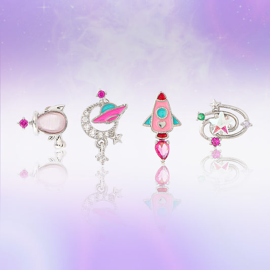 Set of colorful jewelry earrings on a gradient purple background