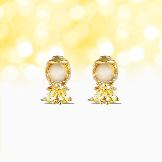 Pair of gold Princess Belle earrings with pearl-like centers on a yellow background