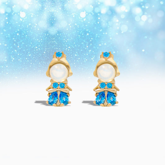 Pair of gold Princess Cinderella Earrings with blue gemstones on a light blue background