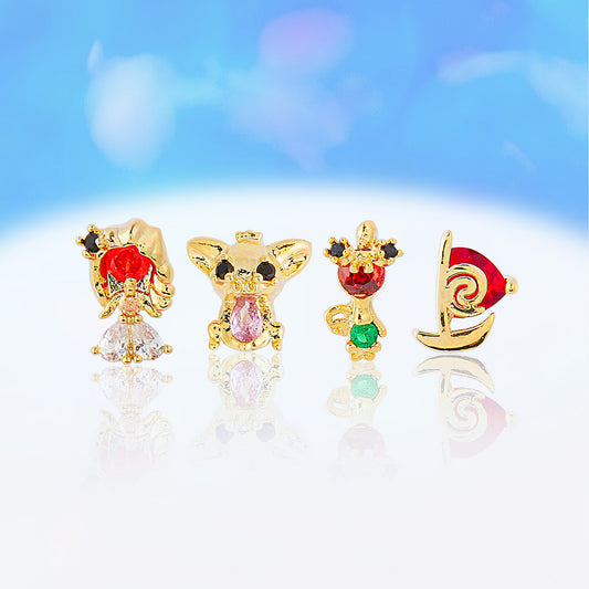 Set of four gold Princess Moana earrings with colorful gemstones on a light blue background