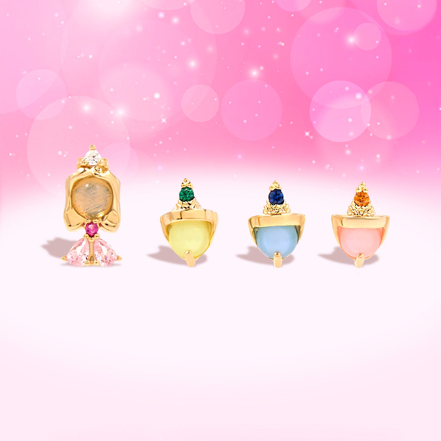 Sleeping Beauty gold earring set on a pink background