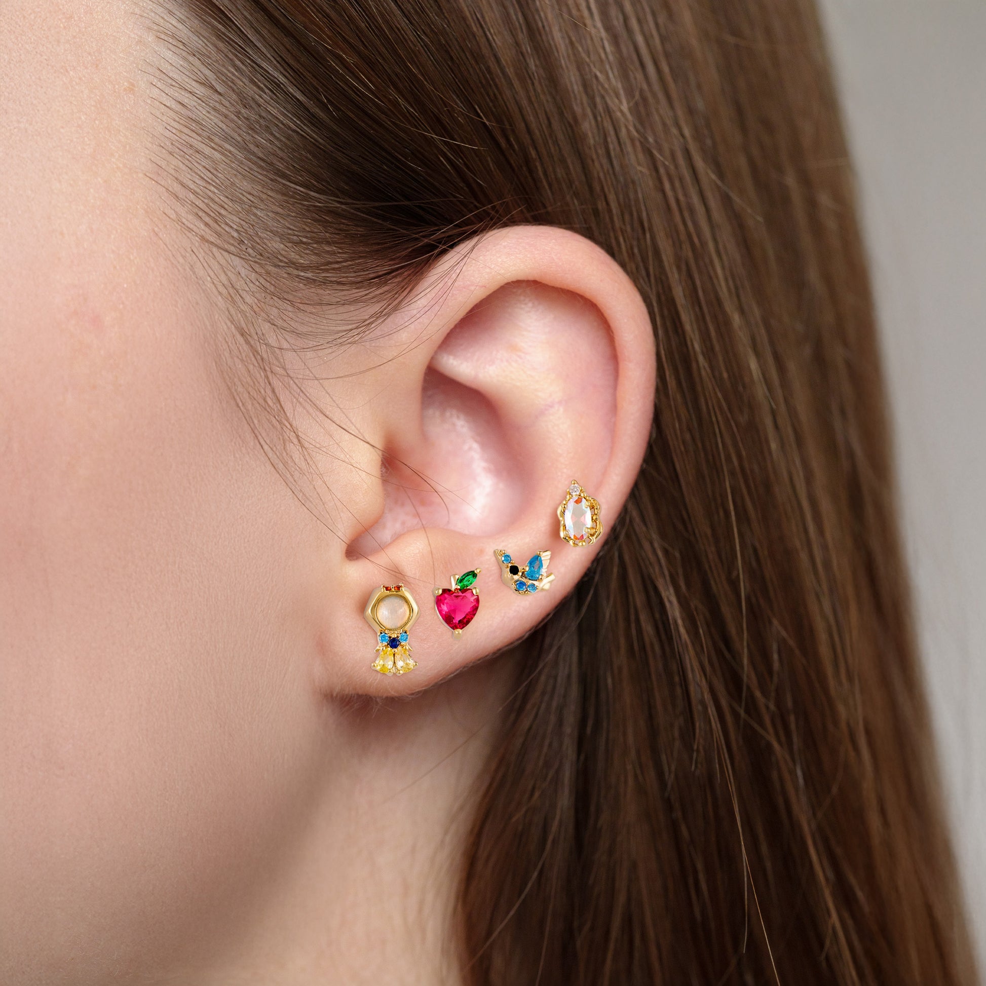 Close-up of an ear wearing Snow-white Princess Earring Set 