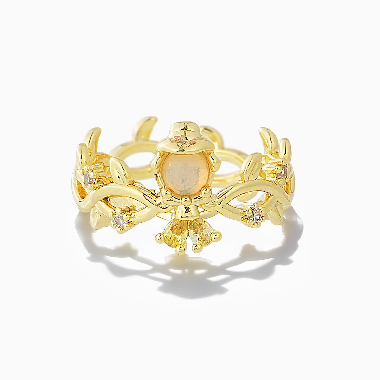 Gold Belle ring with a central gemstone on a white background